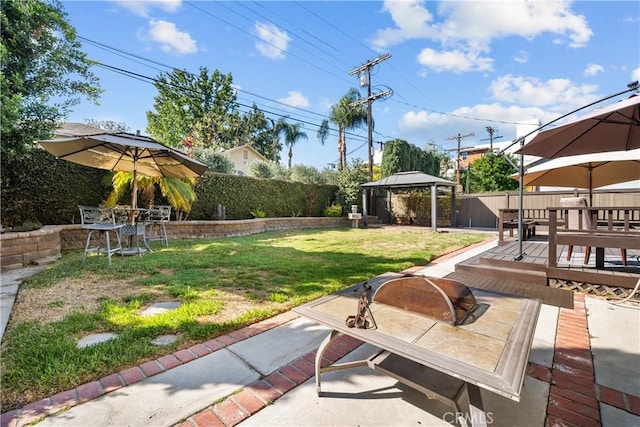 view of yard with a gazebo and a deck