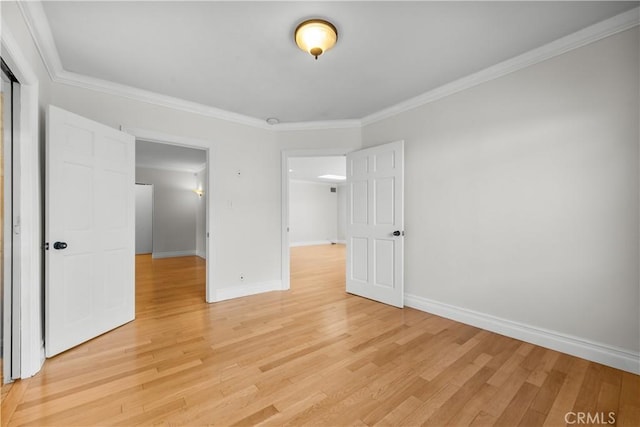 unfurnished bedroom with light hardwood / wood-style flooring and ornamental molding