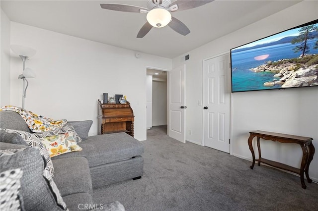 living room featuring carpet floors and ceiling fan