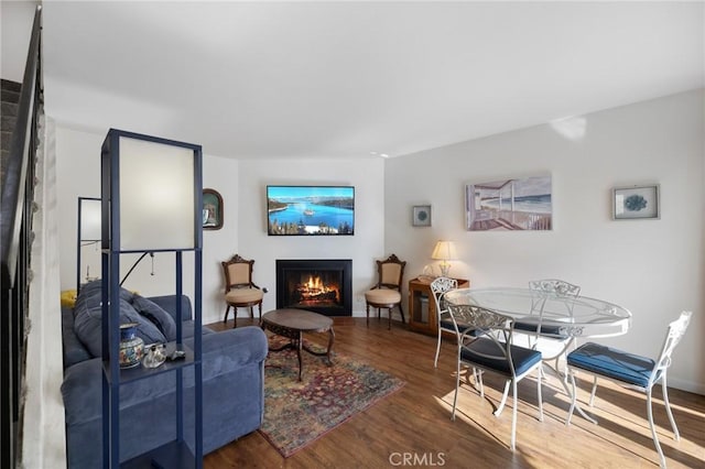 18411 Hatteras St Unit 120, Tarzana, CA 91356 - living room featuring a lit fireplace and wood finished floors