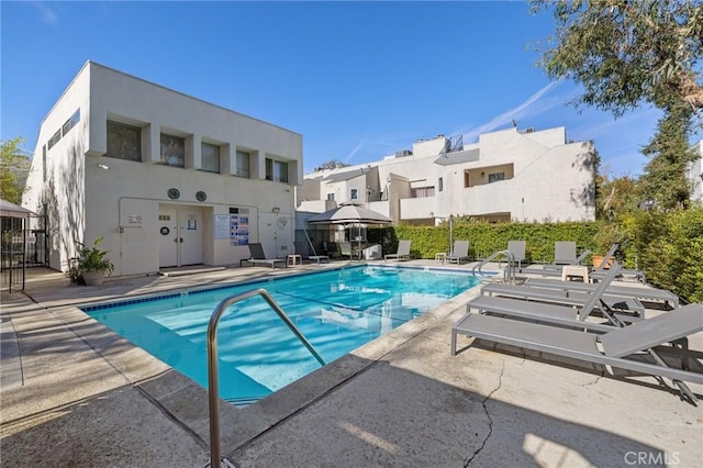 view of swimming pool with a patio area