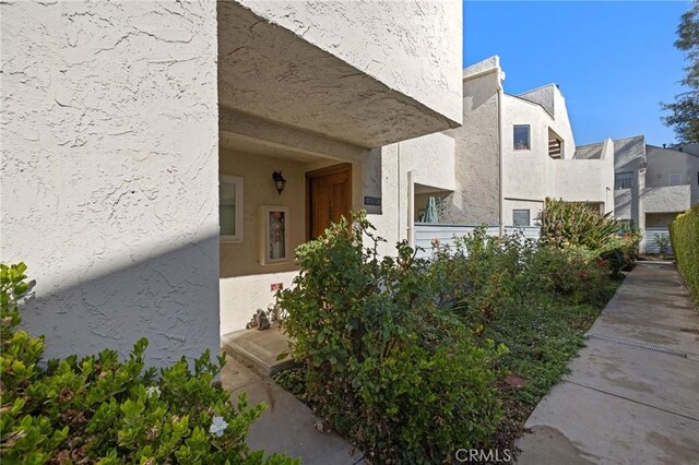 18411 Hatteras St Unit 120, Tarzana, CA 91356 - doorway to property featuring stucco siding