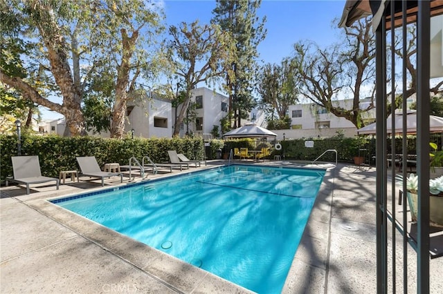 18411 Hatteras St Unit 120, Tarzana, CA 91356 - community pool featuring a gazebo, a patio area, and a residential view