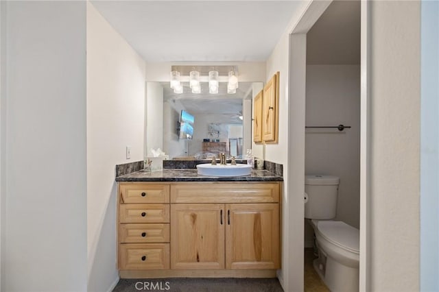 bathroom with vanity and toilet