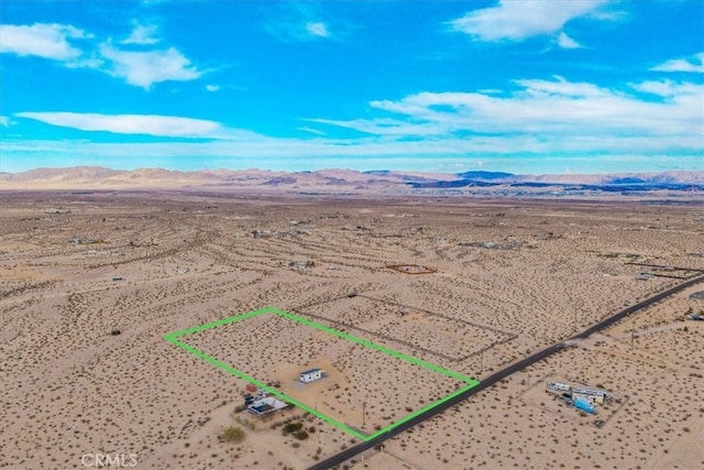 69444 Valle Vista Rd Unit 29, Palms, CA 92277 - aerial view of sparsely populated area with a desert landscape, mountains, and property boundaries highlighted