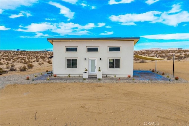 69444 Valle Vista Rd Unit 29, Palms, CA 92277 - view of front of house with a mountain view, stucco siding, and a desert view