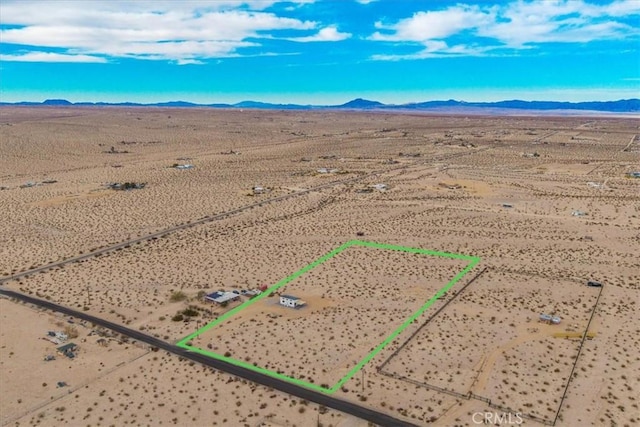 69444 Valle Vista Rd Unit 29, Palms, CA 92277 - aerial view of sparsely populated area featuring property parcel outlined, a desert landscape, and mountains