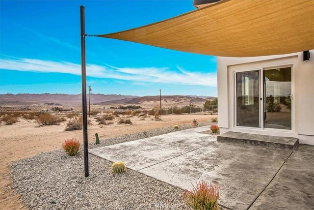 view of patio with a mountain view