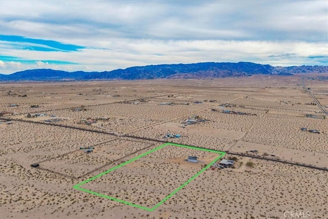 69444 Valle Vista Rd Unit 29, Palms, CA 92277 - overview of rural landscape with property boundaries highlighted, a mountain backdrop, and a desert landscape