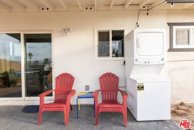 view of patio / terrace featuring stacked washer / dryer