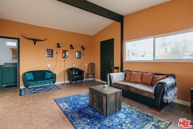 living room featuring tile patterned floors and lofted ceiling with beams