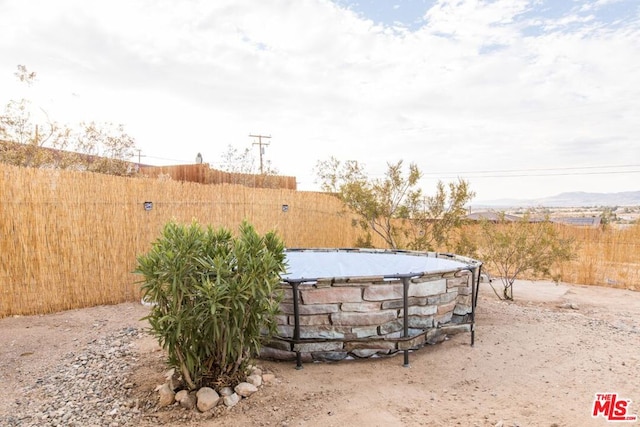 view of yard featuring a fenced in pool