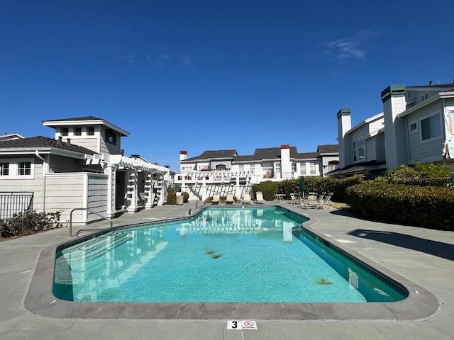 view of swimming pool featuring a patio area