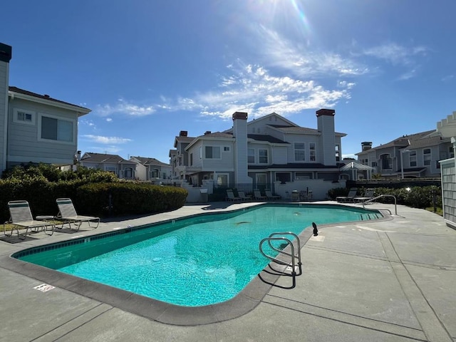 view of swimming pool featuring a patio area