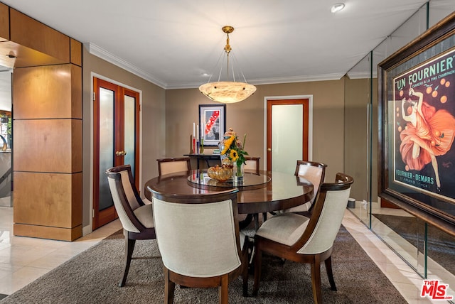 dining area featuring crown molding, french doors, and light tile patterned flooring