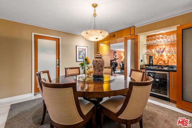 dining area featuring indoor bar, ornamental molding, beverage cooler, and light tile patterned floors