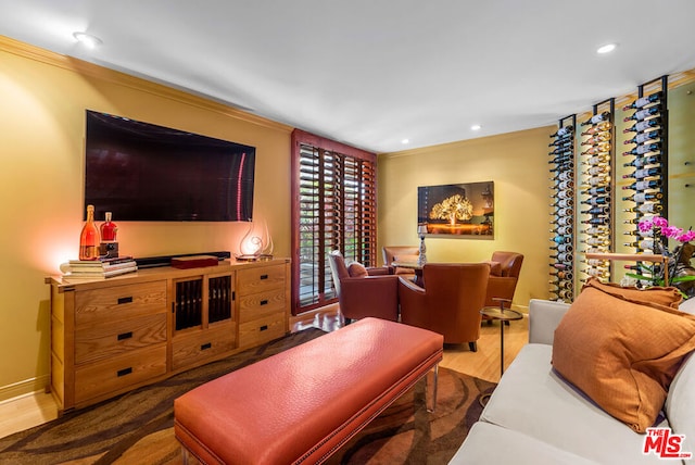 living room featuring hardwood / wood-style flooring and crown molding