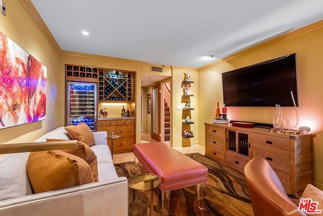 living room with ornamental molding and beverage cooler