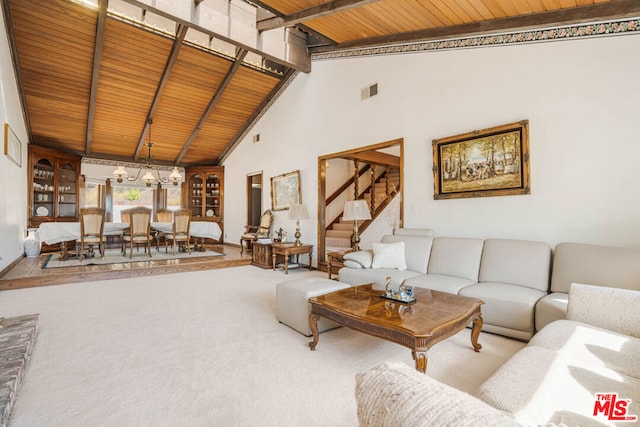 carpeted living room featuring beamed ceiling, wooden ceiling, and high vaulted ceiling