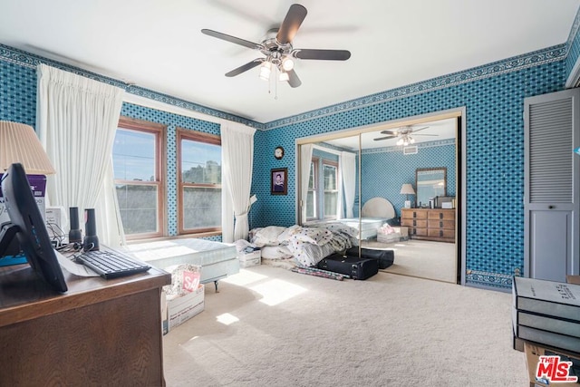 carpeted bedroom with ceiling fan