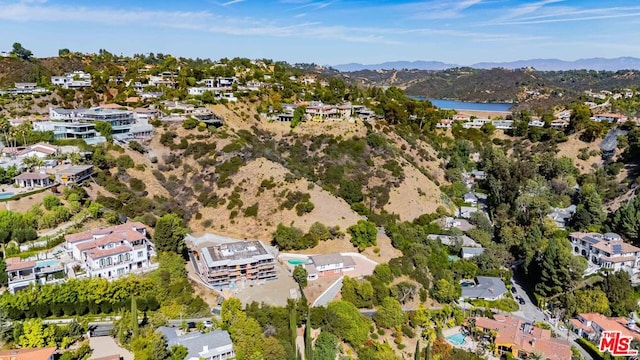 birds eye view of property featuring a mountain view