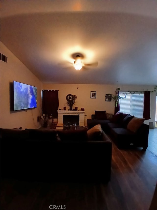 living room with lofted ceiling and ceiling fan