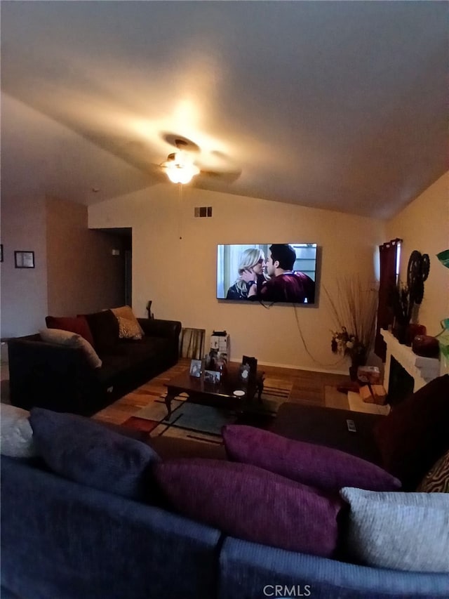 living room featuring lofted ceiling