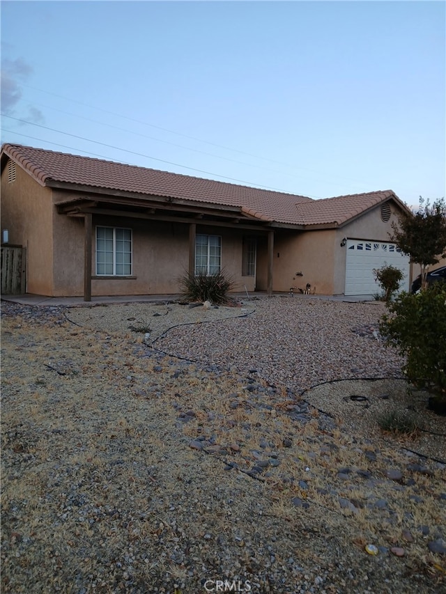 ranch-style house featuring a garage