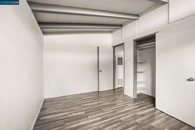 unfurnished bedroom featuring hardwood / wood-style floors