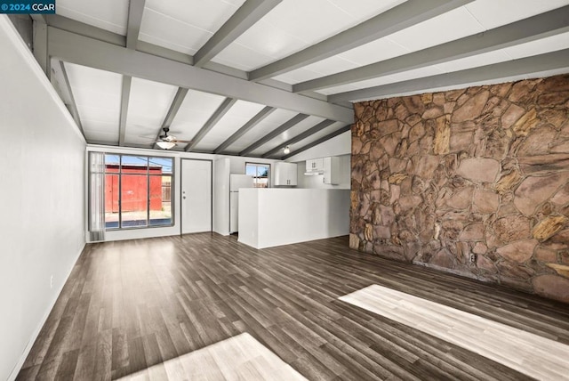 unfurnished living room with vaulted ceiling with beams, dark hardwood / wood-style floors, and ceiling fan