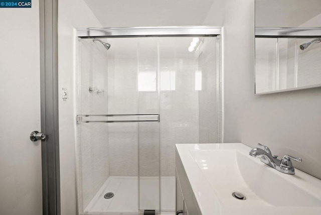 bathroom featuring vanity and walk in shower