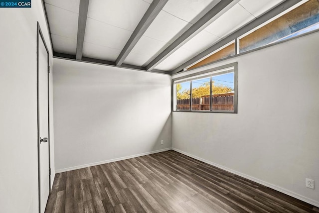 unfurnished room featuring vaulted ceiling with beams and wood-type flooring