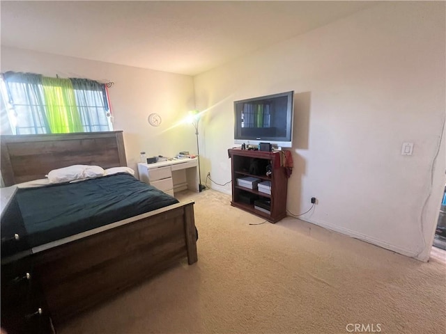 bedroom featuring light colored carpet