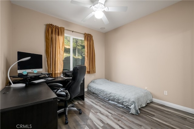 bedroom featuring wood-type flooring and ceiling fan