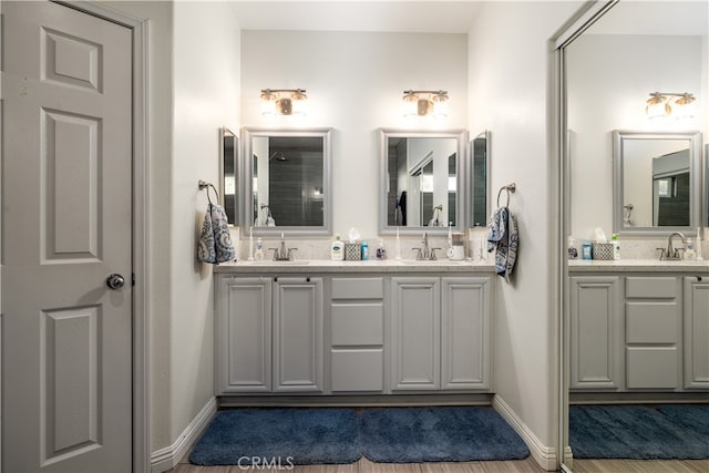 bathroom featuring vanity and wood-type flooring