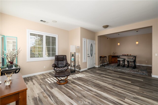 sitting room with hardwood / wood-style floors