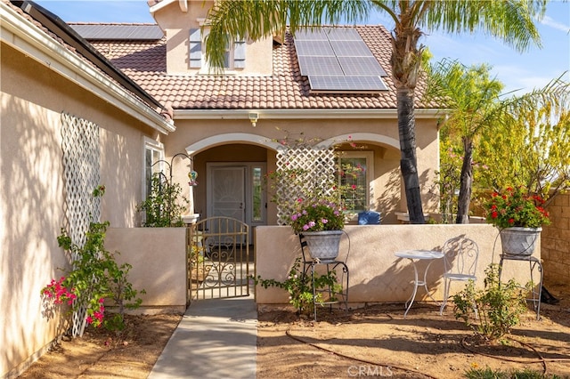 view of front of property with solar panels