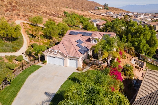 birds eye view of property featuring a mountain view