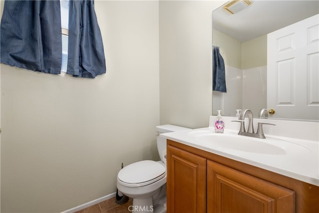 bathroom featuring vanity, toilet, and tile patterned floors