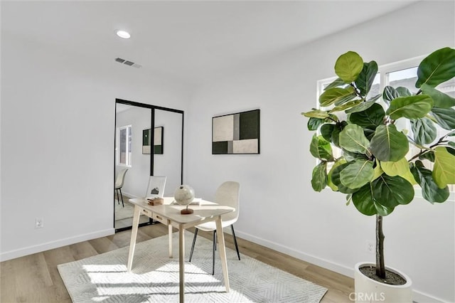 office with light hardwood / wood-style flooring