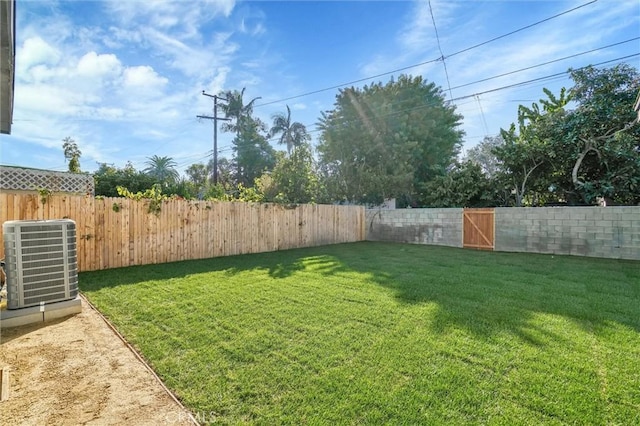 view of yard with central AC