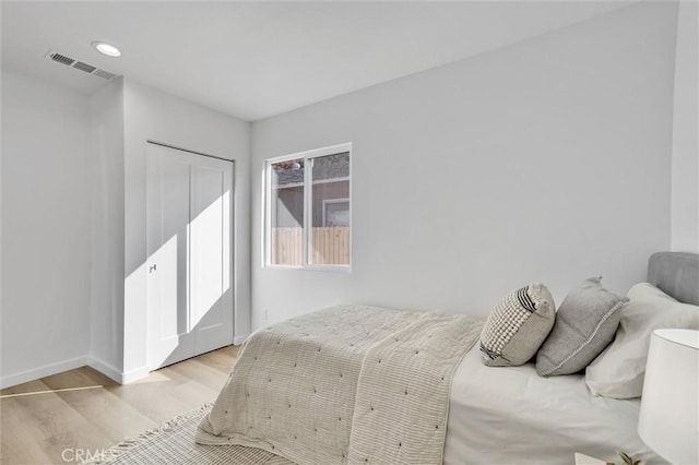 bedroom with light hardwood / wood-style floors