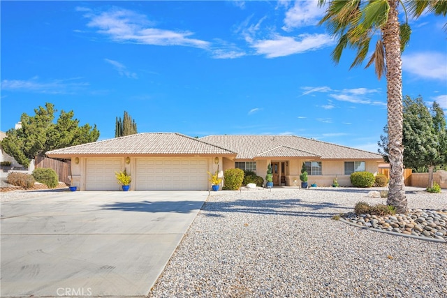 ranch-style house featuring a garage