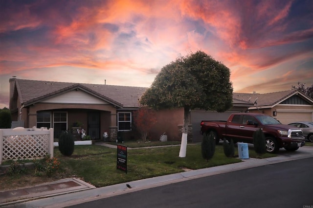 ranch-style house with a lawn