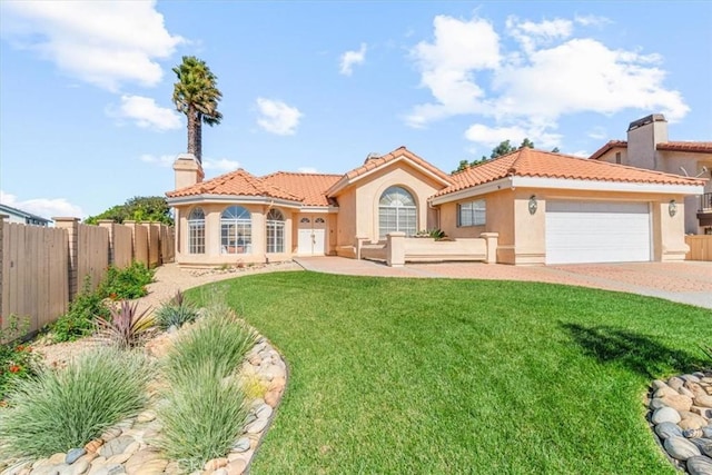 view of front facade featuring a front lawn and a garage