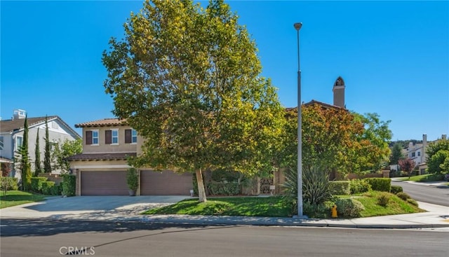 obstructed view of property with a garage