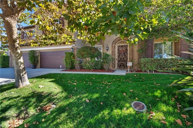 obstructed view of property with a front lawn and a garage