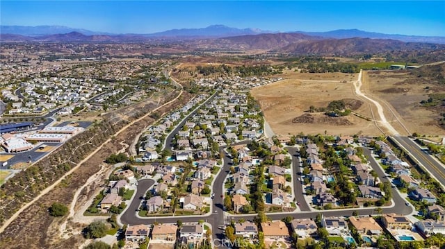 birds eye view of property featuring a mountain view