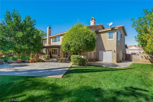 rear view of house featuring a lawn, a patio area, and a pergola