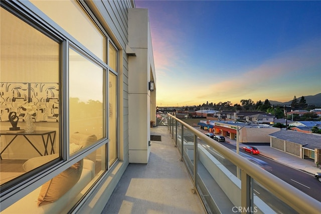 view of balcony at dusk